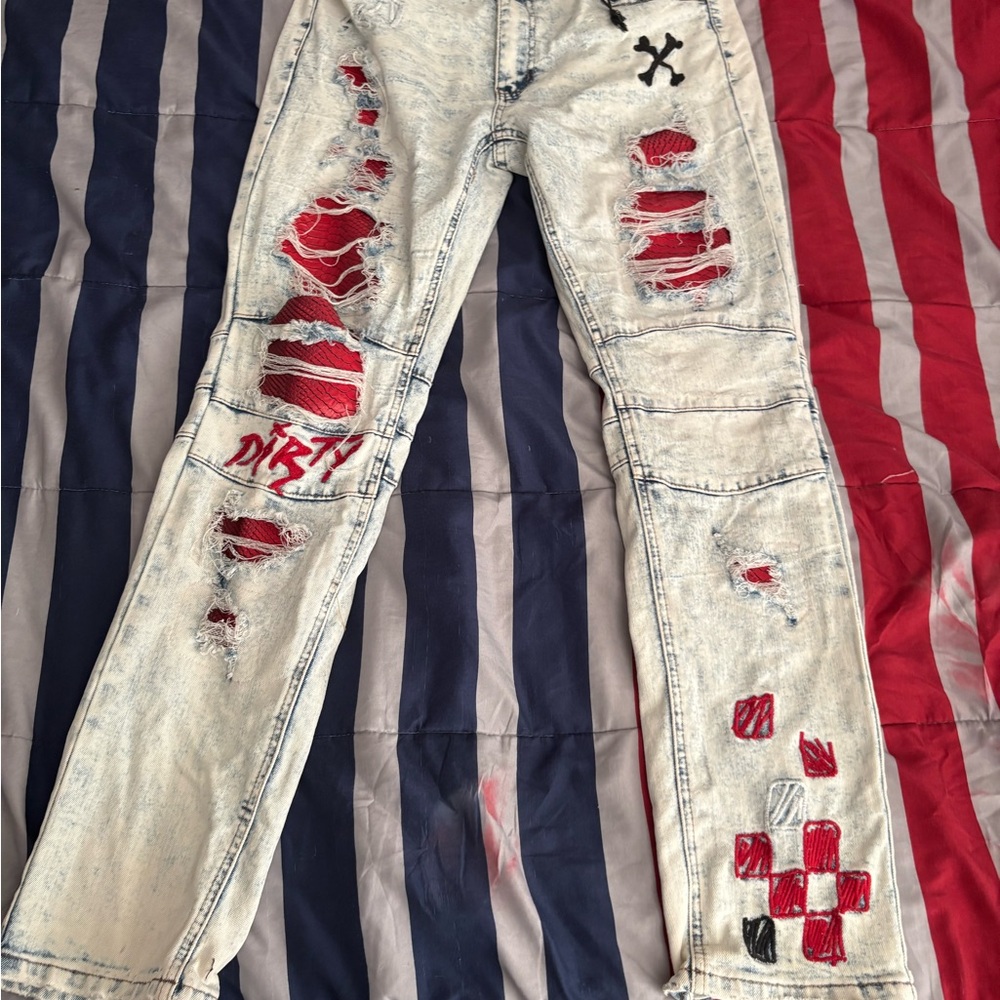 Distressed Light Wash Jeans with Red Accents